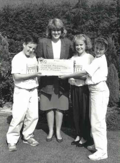 1989 Lifestyle team The Jumblies (Andrew Peach, Lisa Slingsby and Sarah Peach) with cheque for  Mrs Helen Jacques from Cancer Research